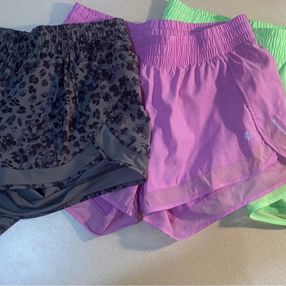 Athleta best selling mesh short. Set of 3 xs. No holes stains or flaws.
